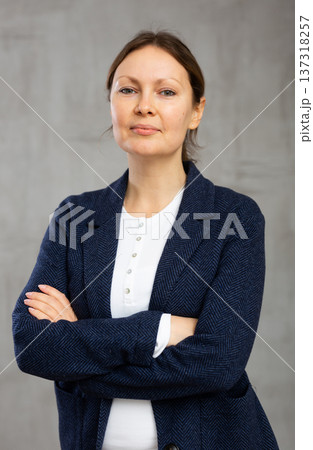 Portrait of smiling woman posing in jacket Portrait of smiling woman posing in jacket 137318257