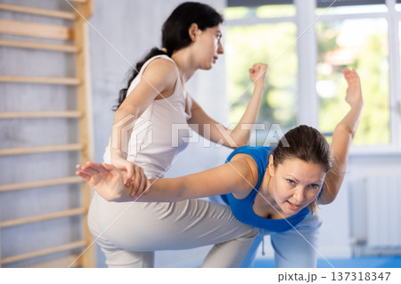 Two women training self-defense techniques in studio Two women training self-defense techniques in studio 137318347