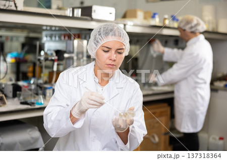 Portrait of young woman lab technician working 137318364