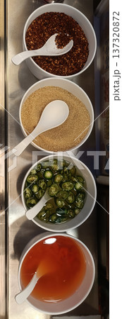 Chili flake sugar sliced chili chili sauce condiment seasoning Four white bowl display chili flake sugar sliced chili chili Chili flake sugar sliced chili chili sauce condiment seasoning Four white bowl display chili flake sugar sliced chili chili 137320872