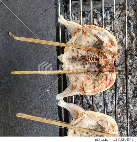 Grilled chicken bamboo skewer street food charcoal grill local cuisine traditional cooking outdoor cooking rustic meal grilled Grilled chicken bamboo skewer street food charcoal grill local cuisine traditional cooking outdoor cooking rustic meal grilled 137320875