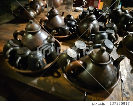This is a group of clay teapot with black colour This is a group of clay teapot with black colour 137320917