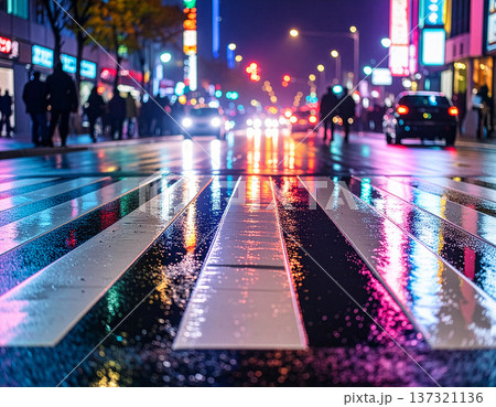 Urban crosswalk at night with neon lights reflecti 137321136