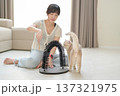 Smiling cheerful asian woman enjoying quality time playing with cute cat pet at cozy home promoting positive mental health and wellness in friendly relaxing environment 137321975