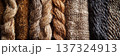 Close up of various natural fiber textures, including rope and woven fabric, in earthy tones 137324913