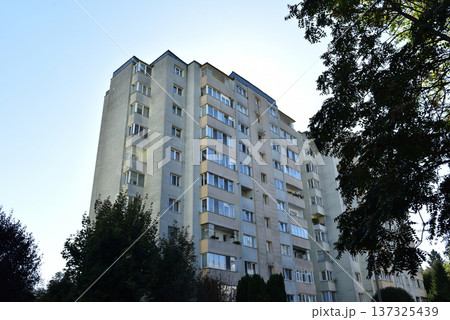 Suburban neighborhood built in communism. Post Soviet concrete flat of blocks 137325439