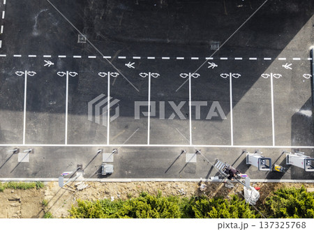 Electric vehicle parking spaces in a public parking lot during daylight 137325768