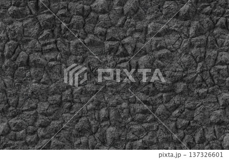 Dark grey rough stone wall texture with irregular blocks and deep shadows for backdrop. 137326601
