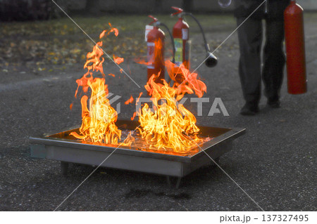 corporate safety - exercise during a firefighting course corporate safety - exercise during a firefighting course 137327495