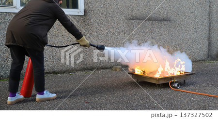 corporate safety - exercise during a firefighting course corporate safety - exercise during a firefighting course 137327502