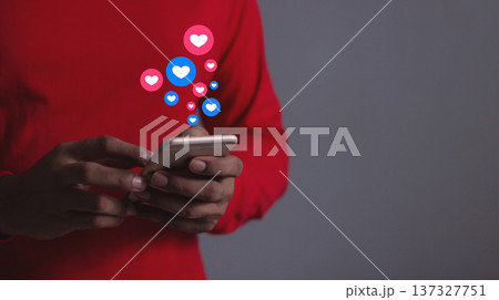 Love And Like Social Media Concept, Young Man hand using smart phone mobile, with Social Media, on soft blurred background 137327751