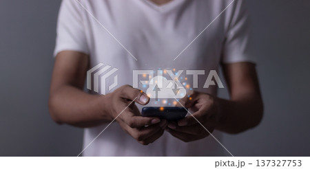Young man with smartphone mobile hand touching to cloud computing diagram, Data storage, Cloud technology, Cloud Computing Storage Young man with smartphone mobile hand touching to cloud computing diagram, Data storage, Cloud technology, Cloud Computing Storage 137327753