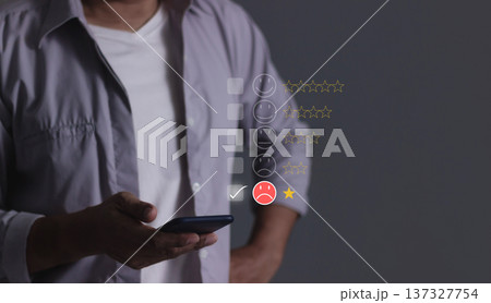 Customer Review, Young man hand holding smartphone to review and gives 1 star, with poor service results, Bad review Rated just 1 star Feedback options Customer Review, Young man hand holding smartphone to review and gives 1 star, with poor service results, Bad review Rated just 1 star Feedback options 137327754