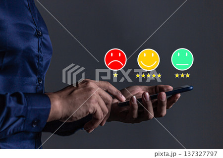 Customer Review, Young Man hand holding Smart Phone with five star to review and give 5 stars with very good results in service, Good review 5 star rating choice feedback Customer Review, Young Man hand holding Smart Phone with five star to review and give 5 stars with very good results in service, Good review 5 star rating choice feedback 137327797