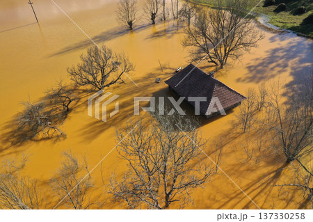 Sinking house in the ghost village of Geamana, Romania, choked of toxic mining residuals, aerial view 137330258