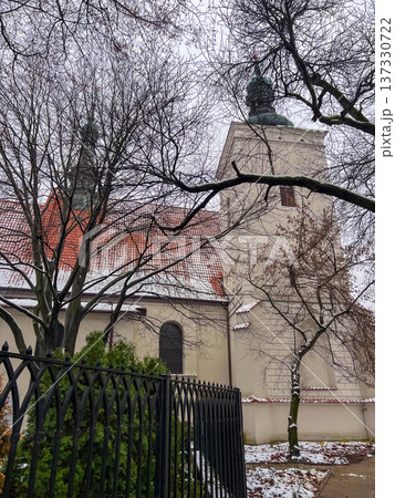Historic church building with unique design in a city square on a cloudy day Historic church building with unique design in a city square on a cloudy day 137330722