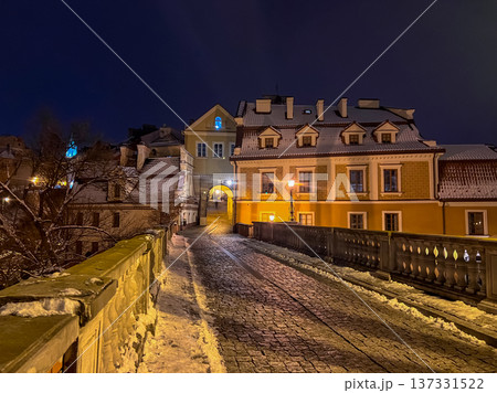 Night scene of a street with buildings and a bridge in a city Lublin Night scene of a street with buildings and a bridge in a city Lublin 137331522