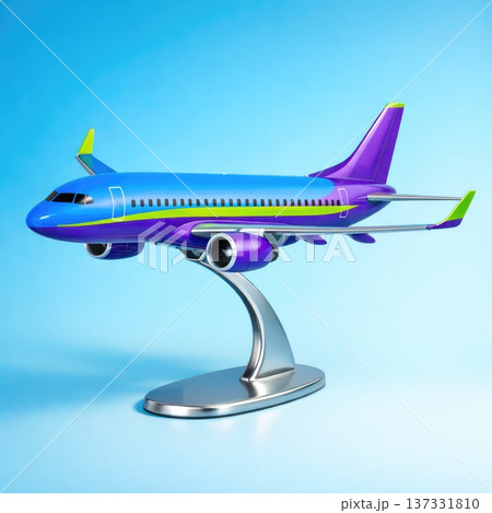 Colorful modern passenger airplane model on stand isolated on blue background Colorful modern passenger airplane model on stand isolated on blue background 137331810