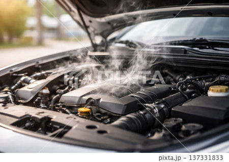 Smoking Car Engine Under Open Hood Indicating Mechanical Failure or Overheating Problem Smoking Car Engine Under Open Hood Indicating Mechanical Failure or Overheating Problem 137331833