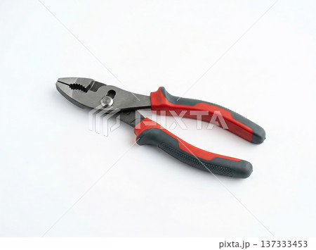 Red and Black Slip Joint Pliers, Versatile Hand Tool for Gripping, Bending, and Cutting Wires, Isolated on White Red and Black Slip Joint Pliers, Versatile Hand Tool for Gripping, Bending, and Cutting Wires, Isolated on White 137333453