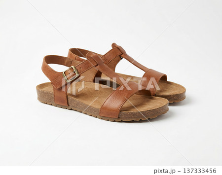 Comfortable Brown Leather Sandals with Cork Soles, Stylish Summer Footwear for Women, Isolated on White 137333456