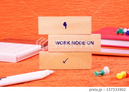 Stacked wooden blocks declare work mode active Stacked wooden blocks declare work mode active 137333902