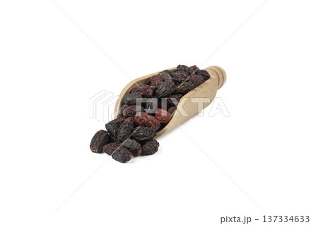Dogwood or Cornel fruit herb used in herbal medicine in wooden scoop isolated on white background. Medicinal herb. Dogwood or Cornel fruit herb used in herbal medicine in wooden scoop isolated on white background. Medicinal herb. 137334633