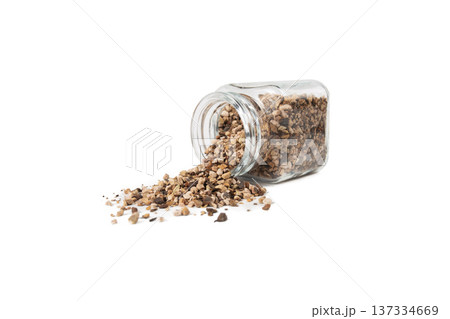 Bistorta officinalis known as bistort, common bistort, European bistort or meadow bistort falling from glass jar isolated on white background. Bistorta officinalis known as bistort, common bistort, European bistort or meadow bistort falling from glass jar isolated on white background. 137334669