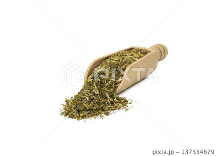 passion flower herb in latin - passiflora incarnata in wooden scoop isolated on white background. Medicinal herb. 137334679