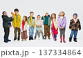 Group of children wearing colorful autumn outfits standing together in studio. 137334864