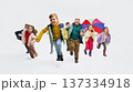 Children running toward camera wearing colorful mid season kids fashion outfits in studio. 137334918