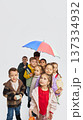 Group of children walking together wearing colorful mid season kids fashion clothes in studio. 137334932
