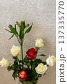 Fresh roses bouquet in glass vase. White and red flowers with green leaves and buds. Elegant home decoration 137335770