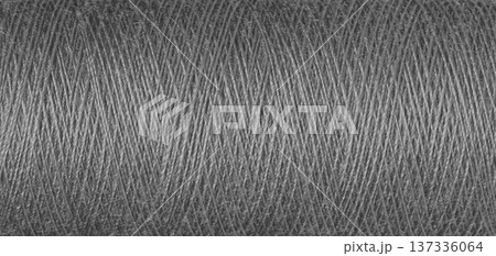 macro texture of a skein of grey sewing thread 137336064