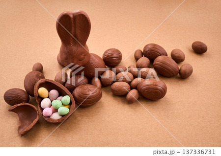 Chocolate easter bunny with eggs and candy treats Chocolate easter bunny with eggs and candy treats 137336731