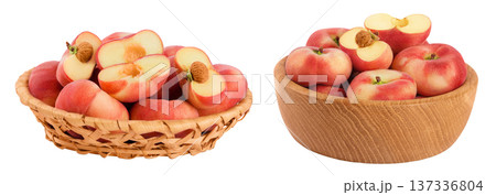 chinese flat donut peaches in a wicker basket and wooden bowl isolated on white background 137336804