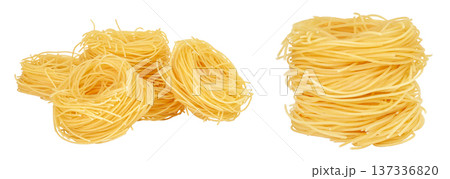 Italian pasta tagliatelle nest isolated on white background with full depth of field. Italian pasta tagliatelle nest isolated on white background with full depth of field. 137336820