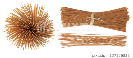 raw wholegrain spaghetti isolated on a white background. Top view. Flat lay raw wholegrain spaghetti isolated on a white background. Top view. Flat lay 137336822