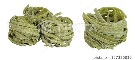 Raw tagliatelle green pasta with spinach isolated on white background Raw tagliatelle green pasta with spinach isolated on white background 137336839