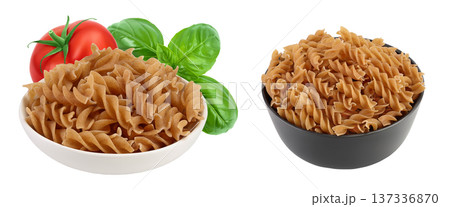 Wolegrain fusilli pasta from durum wheat in bowl isolated on white background with full depth of field. Wolegrain fusilli pasta from durum wheat in bowl isolated on white background with full depth of field. 137336870