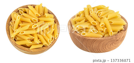 Raw italian penne rigate pasta in wooden bowl isolated on white background with full depth of field. Top view. Flat lay 137336871