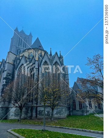 Gothic cathedral of Ghent against a stunning blue sky background 137336980