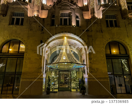 building in Budapest with large windows and chandeliers with ornate architecture building in Budapest with large windows and chandeliers with ornate architecture 137336985