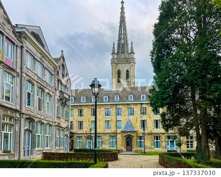 University building in Leuven with gothic tower surounded by modern architecture 137337030