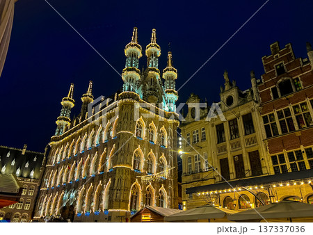 Night view of Leuven town hall decorated for christmas with outdoor market Night view of Leuven town hall decorated for christmas with outdoor market 137337036