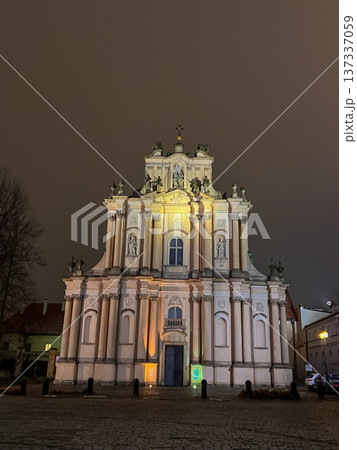 Visitationist Church exterior lit at night in empty square with dark sky, Warsaw 137337059