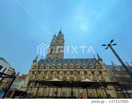 Stunning view of belfry tower and cathedral in historic Ghent under blue skies 137337095