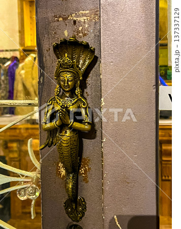Bronze finish door knocker featuring indian goddess profile on display box 137337129