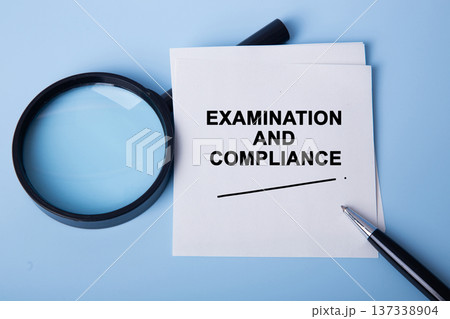 Examination and compliance concept with magnifying glass and pen Examination and compliance concept with magnifying glass and pen 137338904