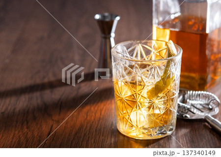 Rusty Nail Cocktail with Lemon Peel in Crystal Glass Rusty Nail Cocktail with Lemon Peel in Crystal Glass 137340149